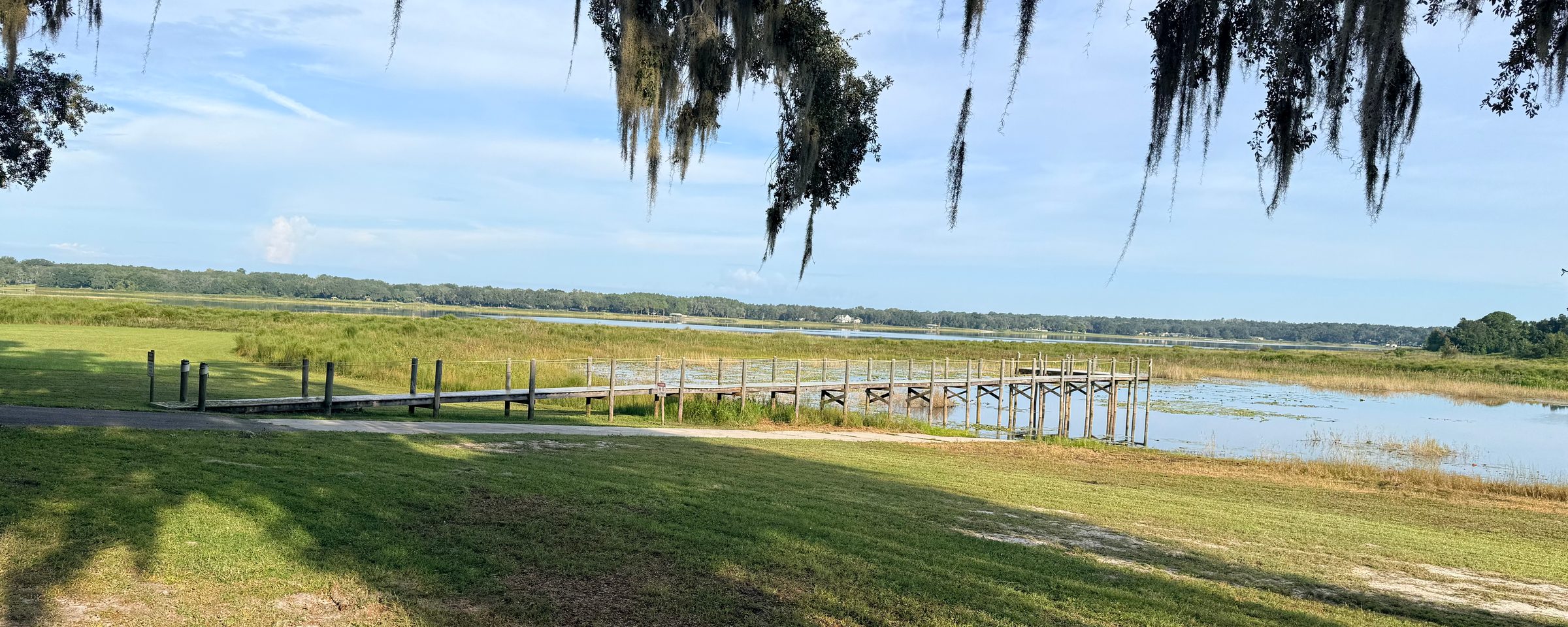 The community pier on Smith Lake, framed by Spanish moss